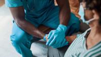 Nurse talking to an elderly patient